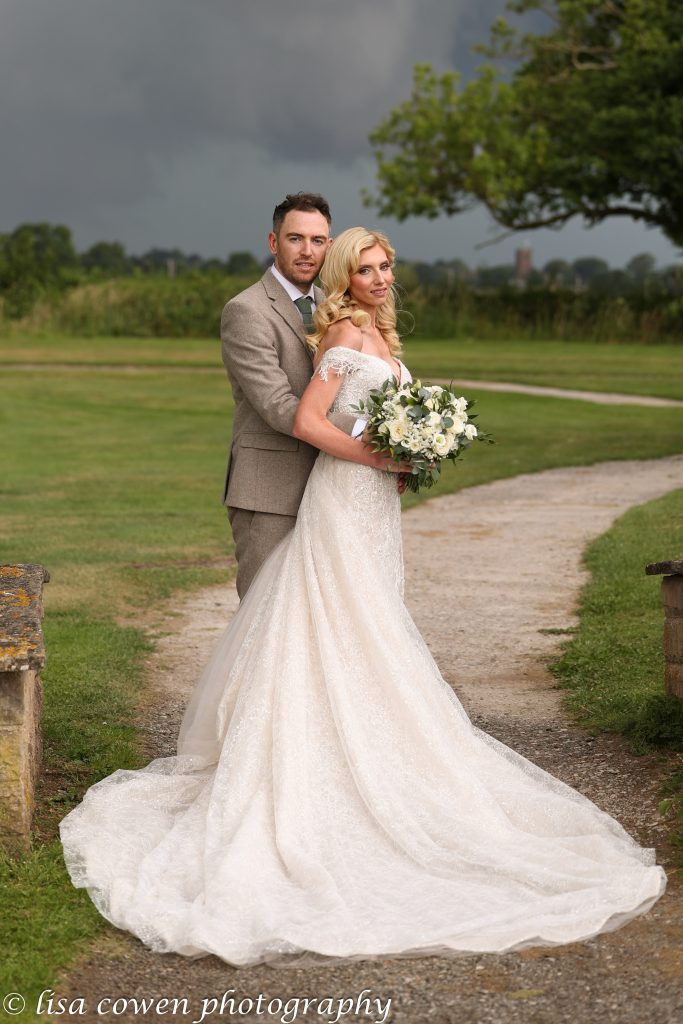 Bride and Groom lit by thunderstorm