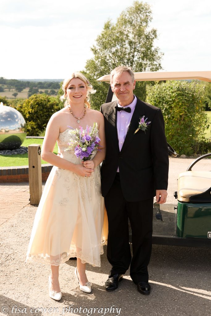 Bride and Dad with a golf buggy