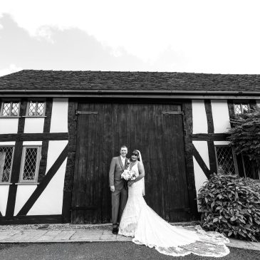 A black and white photo of a bride and groom.
